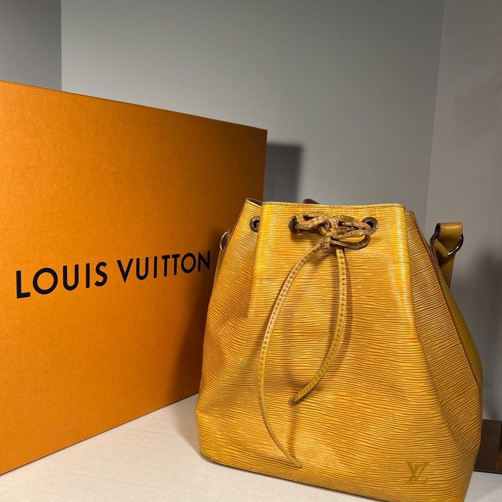 Louis Vuitton gold epi petit Bucket bag with drawstring authenticated o er $500.